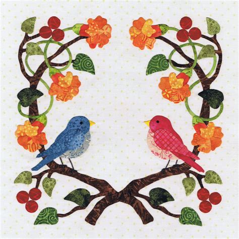 Two Birds Are Sitting On A Tree Branch With Flowers And Leaves In The