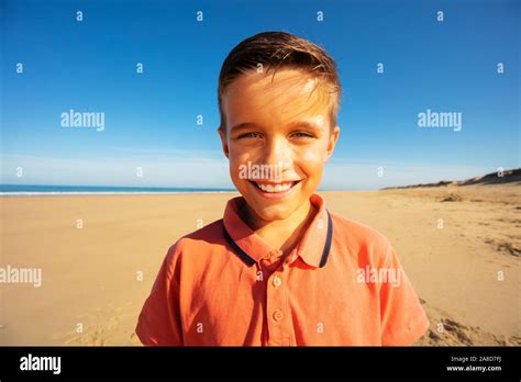 Head And Shoulders Portrait Of Boy Smile On Beach Stock Photo Alamy
