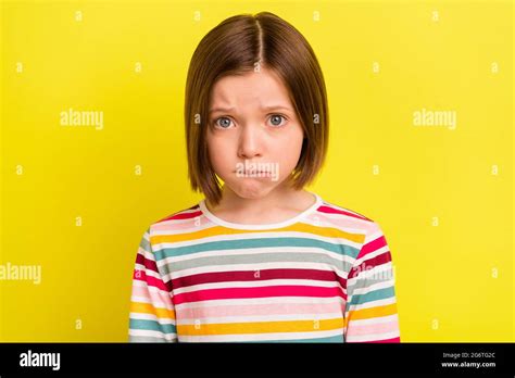 Photo Of Young Unhappy Small Upset Girl Bad Mood Cry Face Bite Lip