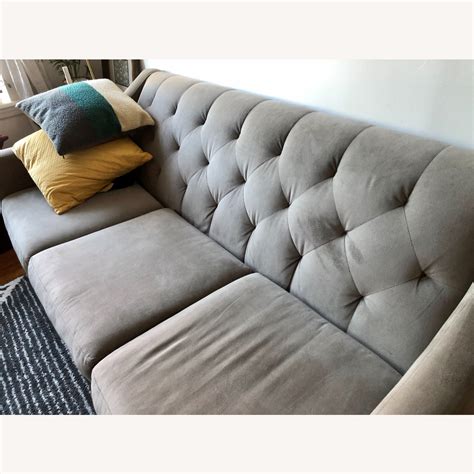 Clean, contemporary lines and elevated detailing set modern sectional sofas from cb2 apart from the rest. Macy's Chloe Velvet Tufted Sofa in Grey - AptDeco