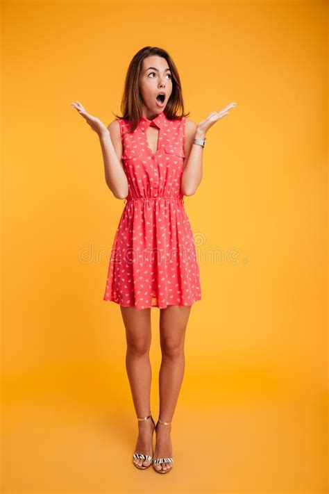 Full Length Portrait Of Beautiful Surprised Woman Standing With Stock