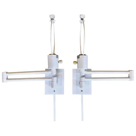 4.6 out of 5 stars 456. Pair of Hansen Double Swing Arm Wall Sconce in White Lacquer For Sale at 1stdibs