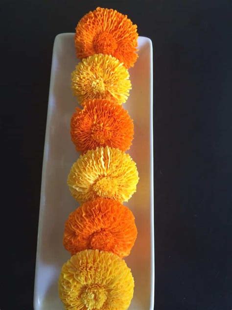 Their whimsy makes them not only a pleasure to behold, but also an enjoyable project to undertake. Marigold flower with crepe paper - Simple Craft Ideas