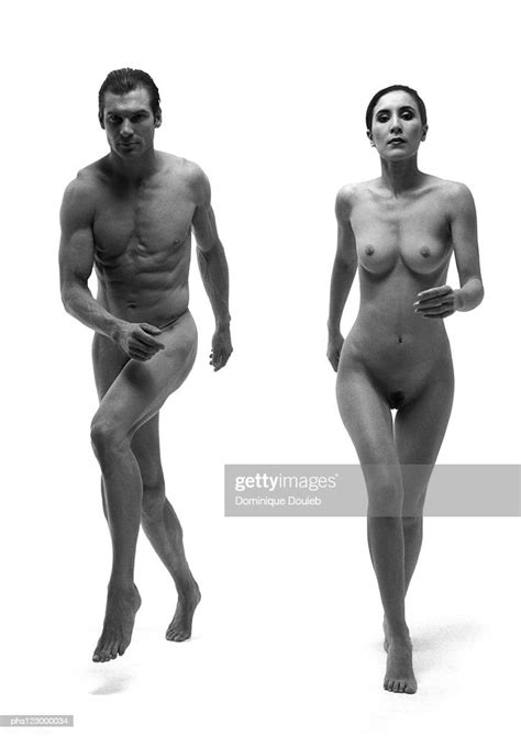 Nudist Couple Standing Side By Side