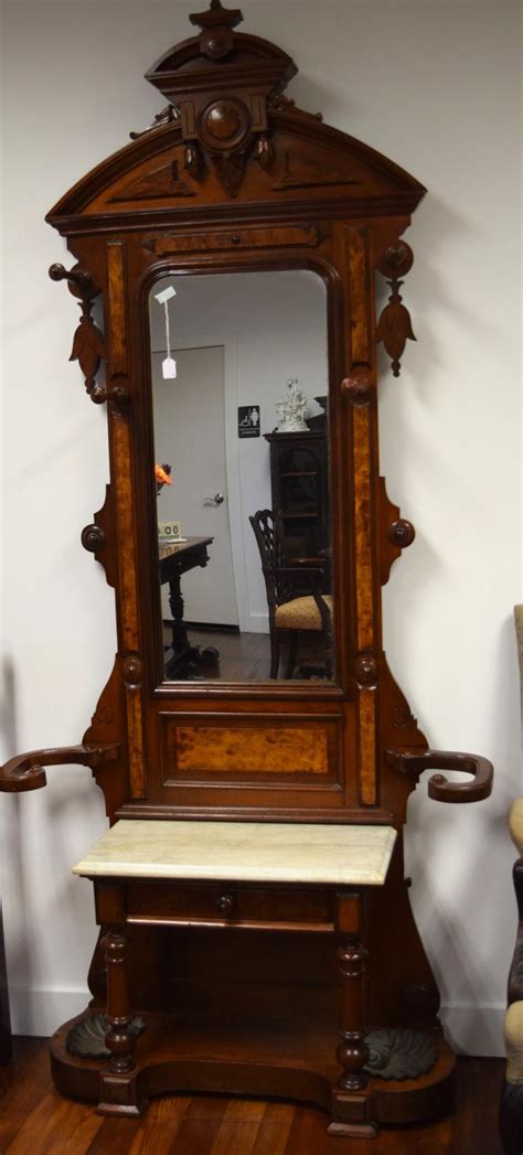 Making your house feel more inviting starts with updating the entrance to your home, and a new entryway hall tree is exactly what your home needs. ANTIQUE VICTORIAN WALNUT HALL TREE/PIER MIRROR: