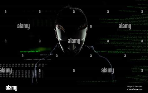 Scary Hacker In White Mask Attacking Personal Data Codes And Numbers