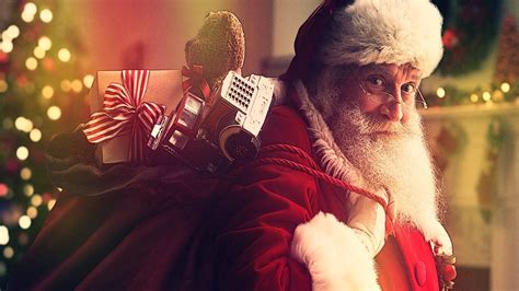 Download Santa Claus With Present Bag Wallpaper