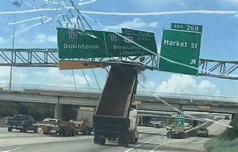 Watch Dump Truck Takes Out Highway Sign Wdbo