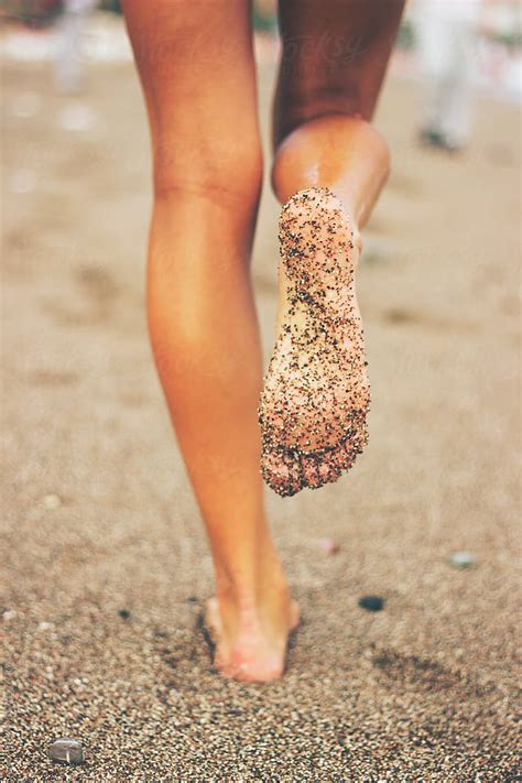 Female Feet On The Beach Covered In Sand By Stocksy Contributor Jovana Rikalo Stocksy
