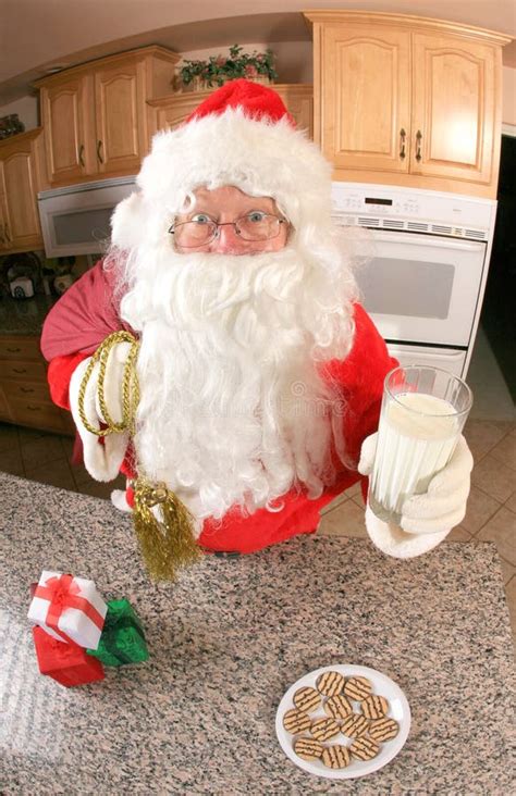 Santa In The Kitchen Eating Cookies Stock Photo Image Of Chocolate