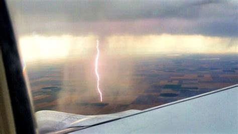 Airplane passenger captures cool shot of lightning striking the ground