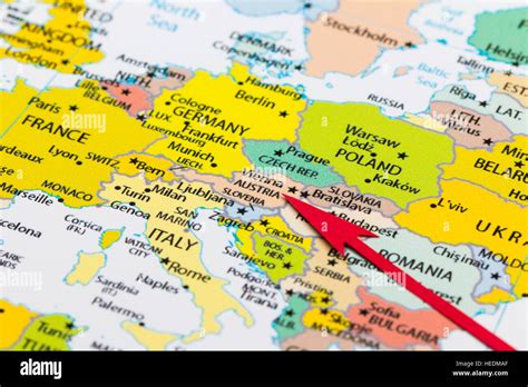 Red Arrow Pointing Austria On The Map Of Europe Continent Stock Photo