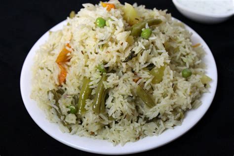 Also known as navratna pulav. veg pulao recipe, how to make veg pulao - Yummy Indian Kitchen