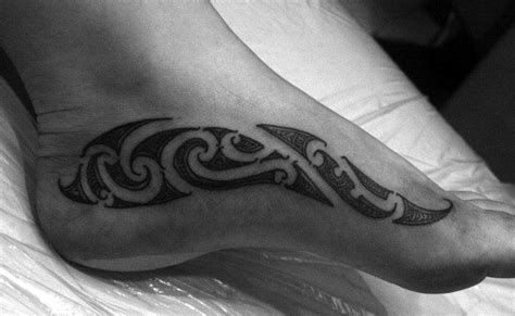 Make male foot more attractive.male foot tattoo designs are very popular and common specially among youth.so here have collected men foot tattoo designs images and tattoos for foot on men. 40 Tribal Foot Tattoos For Men - Manly Design Ideas