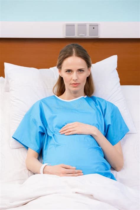 Pregnant Woman Lying In Hospital Bed And Looking At Camera Stock Image Image Of Abdomen