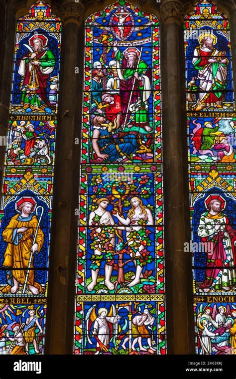 Stained Glass Window With Image Of Adam And Eve Hi Res Stock