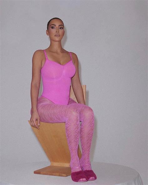 Kim Kardashian Shows Off Her Bare Butt In Pink Thong Bodysuit After