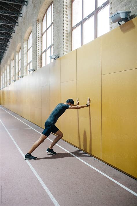 Man Leaning On Wall In Gym Del Colaborador De Stocksy Javier Díez