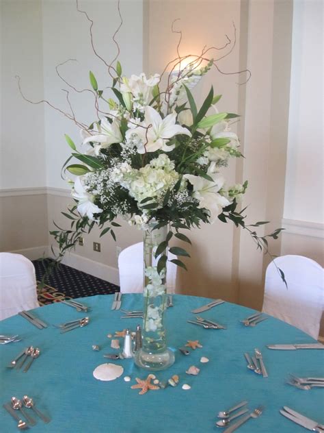 Or, tuck some flowers down inside each bottle and decorate an outdoor patio table filed under: Beautiful beach theme table centerpiece | Table ...