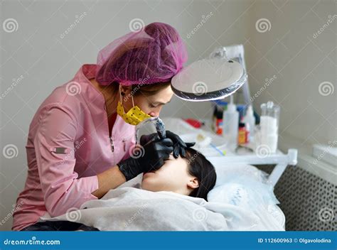 Cosmetologist Does Hardware Skin Care For Girl`s Face Stock Image