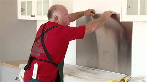 Steps for installing a metal ceiling tile backsplash: How To Install A Stainless Steel Splashback - DIY At ...