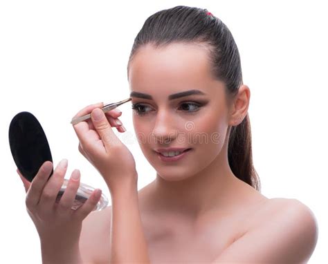 Woman In Beauty Concept Applying Make Up Using Cosmetics Stock Photo