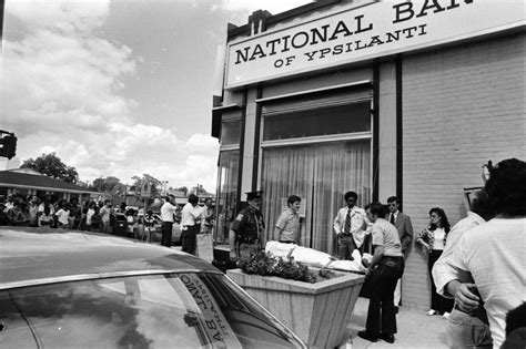 Body of Suspect Removed From Crime Scene of Ypsilanti Bank Robbery and