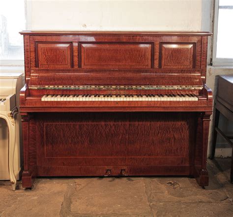 Sheraton Style Pleyel Upright Piano With A Pommele Mahogany Case With