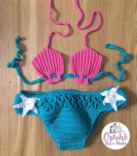 A Crocheted Swimsuit With Two Starfish Decorations