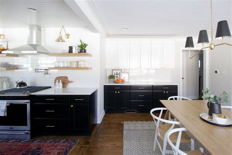 Black cabinets are a change from the lighter colors. How To Clean Dark Kitchen Cabinets | The DIY Playbook