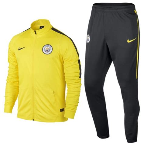 For season 2018/2019 (features tech sweat top and pants). Manchester City yellow presentation tracksuit 2017 - Nike ...