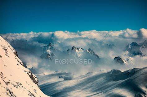 Clouds On Snow Capped Mountain Peaks — Scenics Titlis Stock Photo