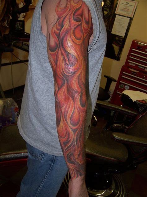 Bright red flame with black smokes behind. Tribal Sleeve Tattoos Designs, Ideas and Meaning | Tattoos For You