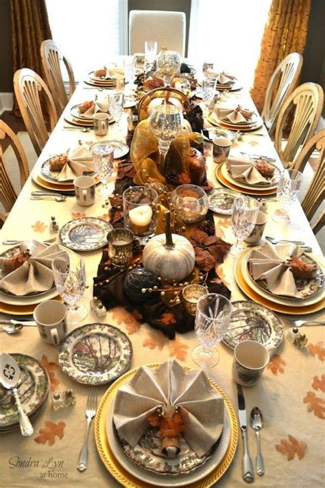 The dinner plate is in a bright gold, with a blue floral salad plate and a white napkin held together by a silver napkin ring. 20 Thanksgiving Dining Table Setting Ideas | Thanksgiving ...