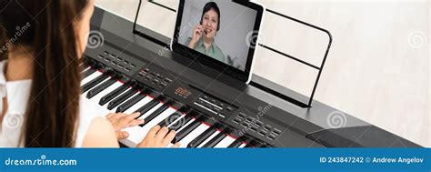 Little Girl Play Piano In Class Education With Tablet In Home Online