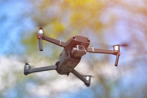 Flying Drone With Camera Hovering Inside A Forrest Natural Background