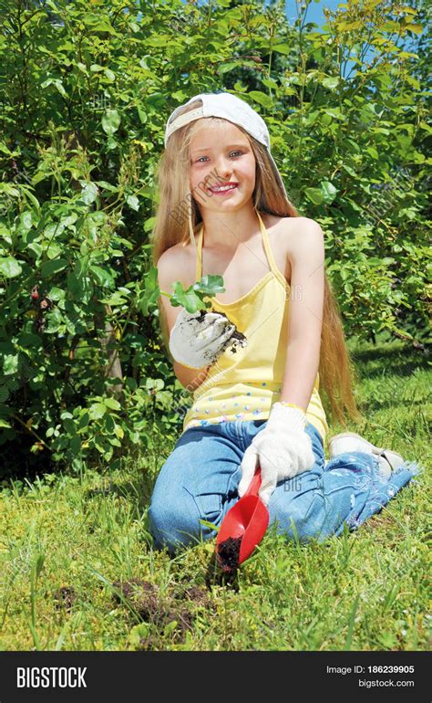 Little Girl Planting Image And Photo Free Trial Bigstock