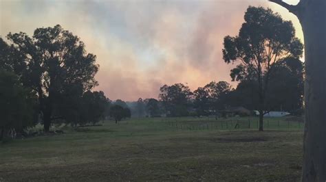 fifty seven bushfires burn across new south wales as crews battle high winds australia news