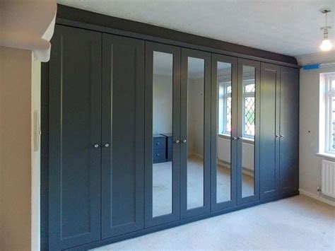We have wardrobes with mirrors integrated in the doors, or featuring mirrored doors, which. Fitted Wardrobe With Hinged Doors In Rich Grey Finish ...