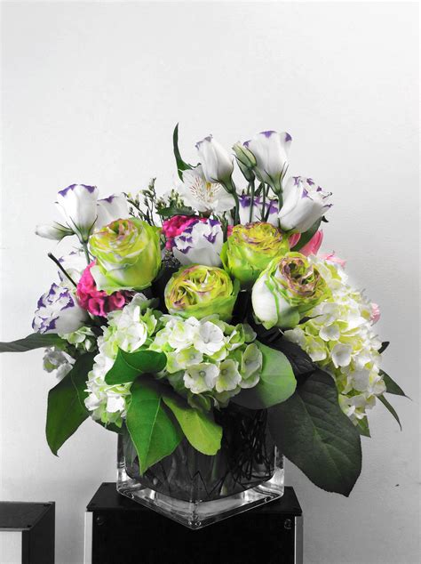 a custom floral arrangement in a square vase designed by flowers naturally in nyc … flower