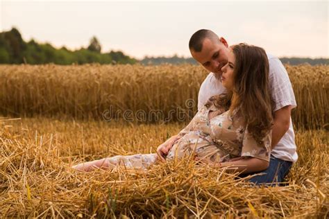 A Young Pregnant Woman With Her Husband Among The Wheat Field Stock Image Image Of Green