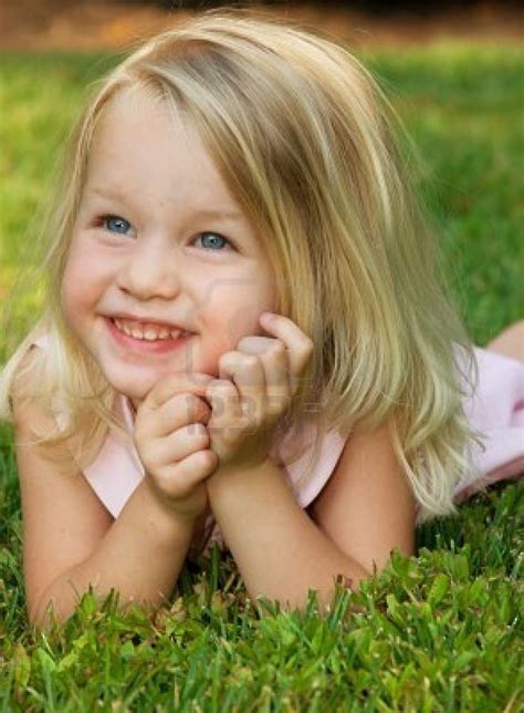 Toddler Girl Smiling Laying On Grass Pretty Girl Toddler Poses