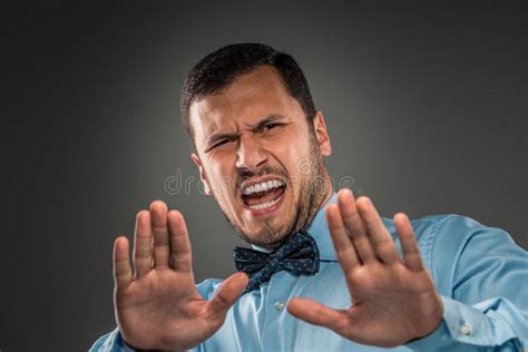 Portrait Angry Upset Young Man In Blue Shirt Butterfly Tie Stock Image