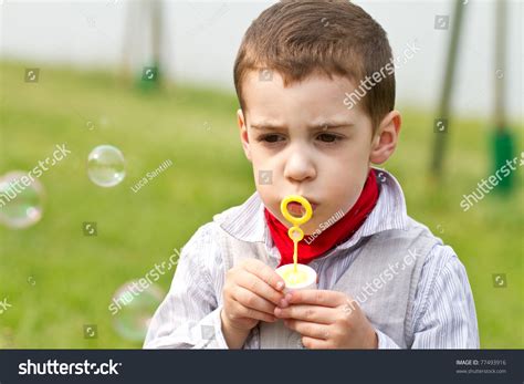 Boy Blowing Bubbles Park Stock Photo 77493916 Shutterstock