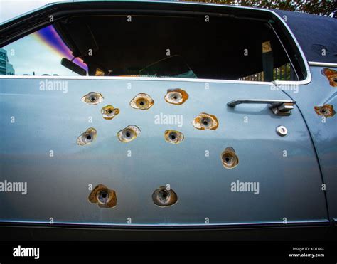 Bullet Holes In A Cadillac Car Door Stock Photo Alamy
