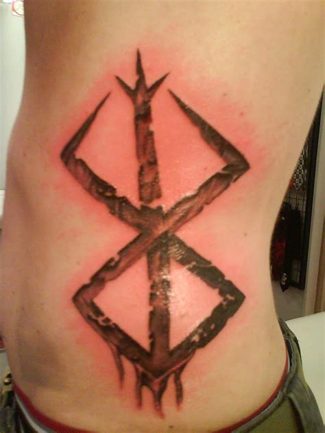 Reminds me of another video game protagonist with a big sword and horrible past. Berserk Tattoo Sacrifice by Strobbo on DeviantArt