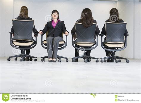 Office solution pro is supported by its readers. Four Business Women Sitting In Office Chairs. Stock Photo ...