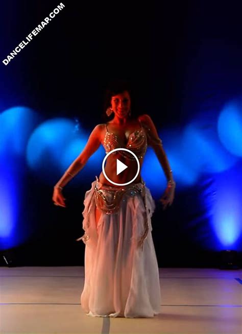 A Woman In A Belly Dance Pose On The Runway