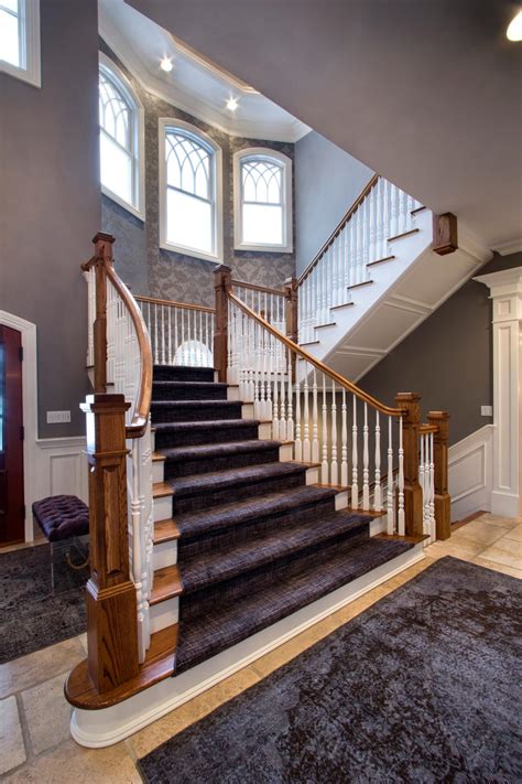 Foyer Stairs With Purple, Gray and Black Stair Runner, Wood Columns and Wallpaper Accent Wall | HGTV