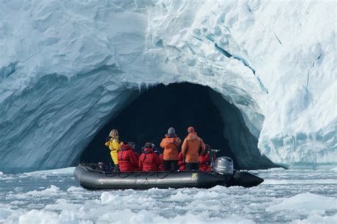 Close Up Of People Looking Into Ice Cave Photograph By Ndp